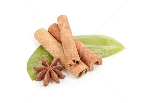 Star Anise, cinnamon and and green leave on white Stock photo © artush
