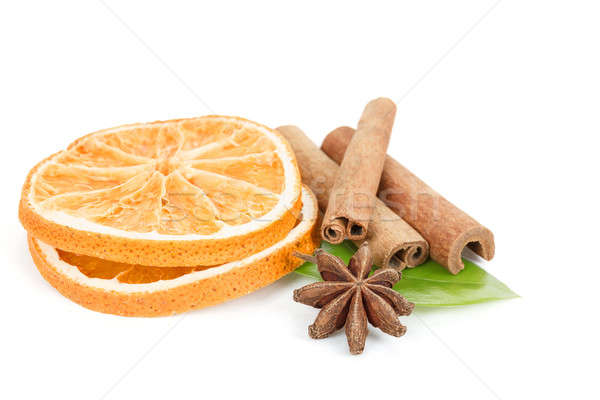 Star Anise, cinnamon and dried orange and green leave on white Stock photo © artush