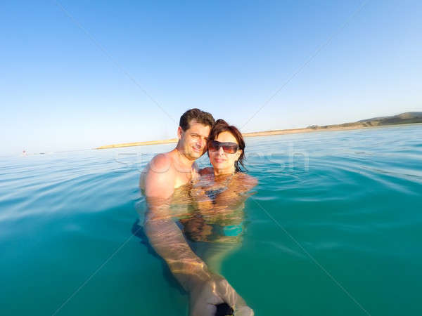 Couple having fun in the water summertime holidays Stock photo © artush