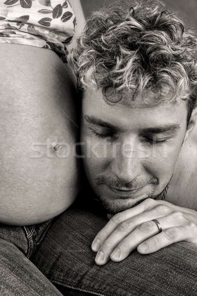 Loving happy couple, pregnant woman with her husband Stock photo © artush