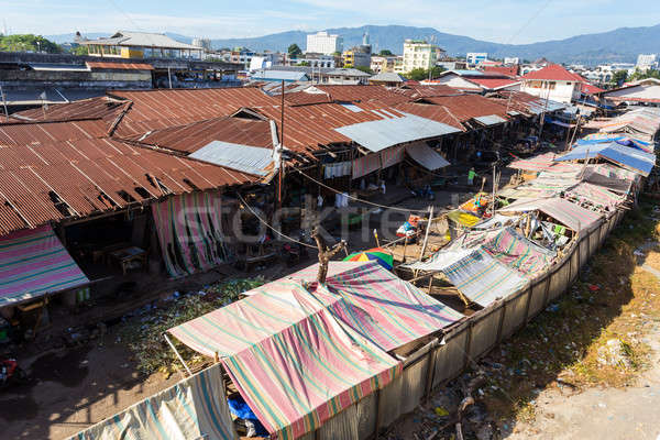 poor houses by the river in shantytown Stock photo © artush