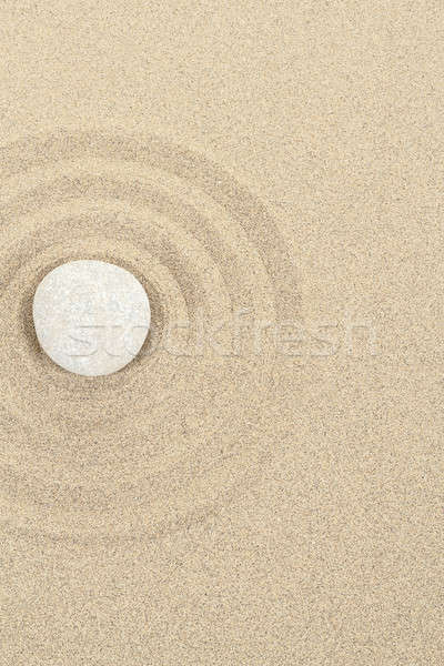 zen stone in sand with circles Stock photo © artush