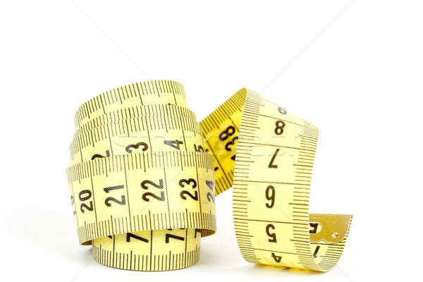 Yellow measuring tape isolated on white Stock photo © artush