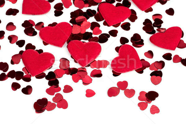 Red hearts confetti and fabric heart on white background Stock photo © artush