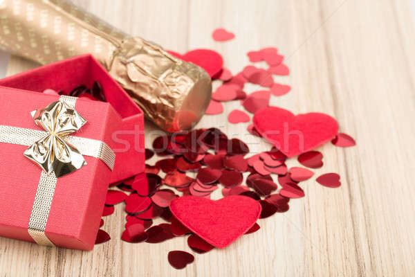 bottle of vine, red hearts and small present Stock photo © artush