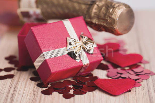 bottle of vine, red hearts and small present Stock photo © artush