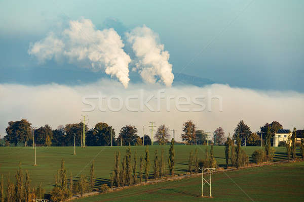 smoking chimneys in from factory hidden in mist Stock photo © artush