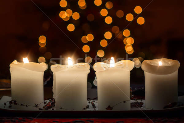 Burning candle with christmas tree bokeh Stock photo © artush