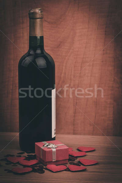 bottle of vine, red hearts and small present a retro style Stock photo © artush