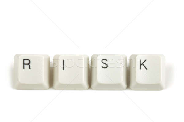 risk from scattered keyboard keys on white Stock photo © artush