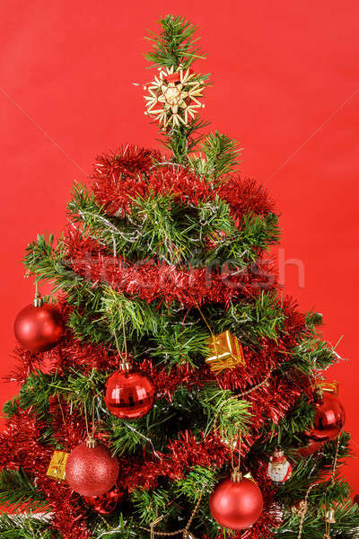 Decorated christmas tree on red background Stock photo © artush