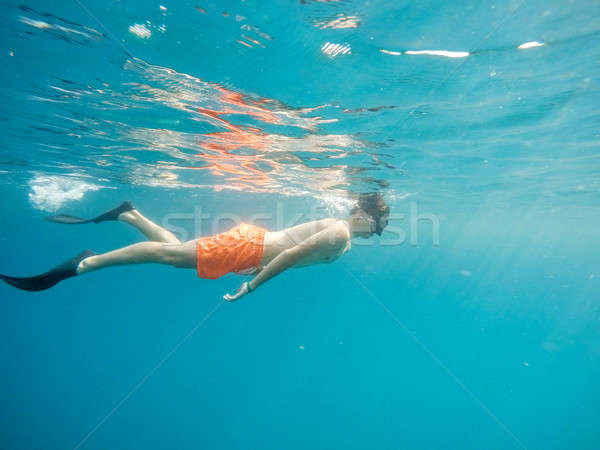 Young boy Snorkel swim in red sea Stock photo © artush