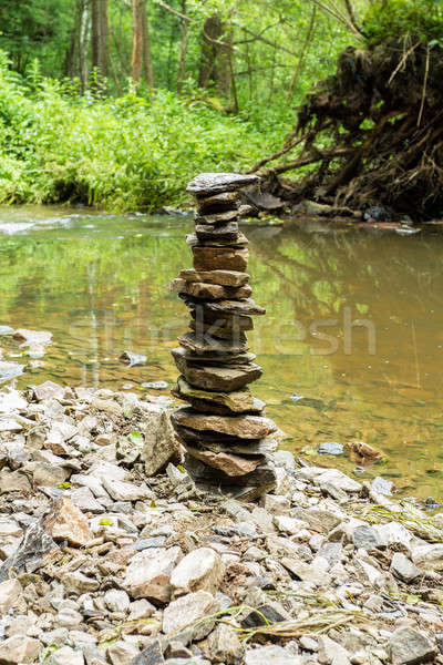 Stones pyramid near small river Stock photo © artush