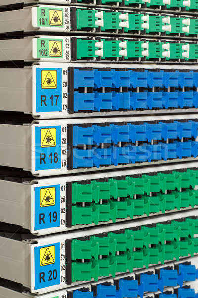 fiber optic rack with high density of blue and green SC connectors Stock photo © artush