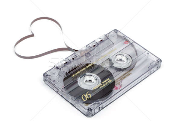 Audio cassette tape on white backgound. Film shaping heart Stock photo © artush