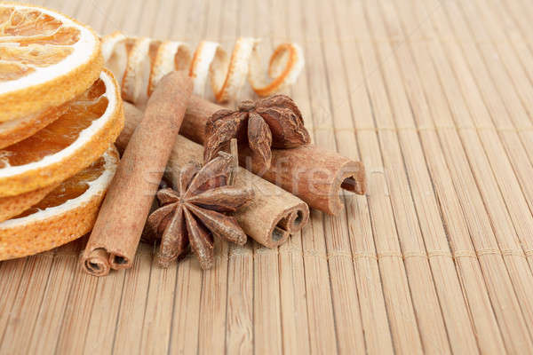 Star Anise, cinnamon and dried orange wooden background  Stock photo © artush