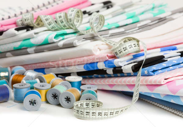cotton fabric material, tailor measurement tape and spools of co Stock photo © artush