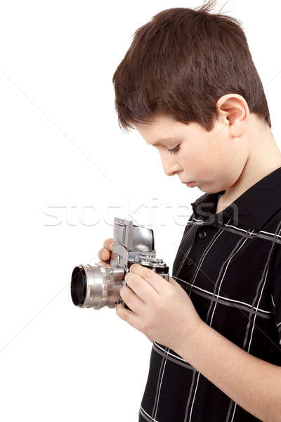 Fiatal srác öreg klasszikus analóg kamera néz Stock fotó © artush