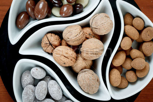 detail of almonds in chocolate and walnuts Stock photo © artush