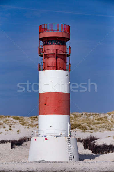 lighthouse at heligoland dune island Stock photo © artush