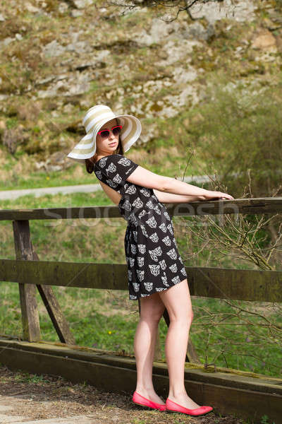 Stock photo: cheerful fashionable woman with hat