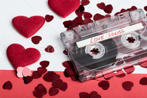 Audio cassette tape on red backgound with fabric heart Stock photo © artush