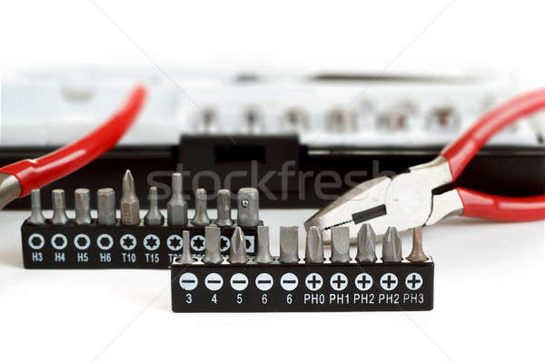 Screwdriver Bit Set on White with pliers Stock photo © artush