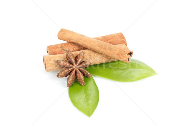 Star Anise, cinnamon and and green leave on white Stock photo © artush