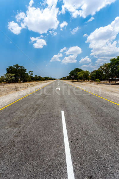 Stock photo: Endless road with blue sky