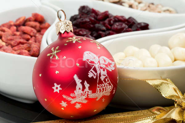 Red christmas bal with chocolate nuts Stock photo © artush