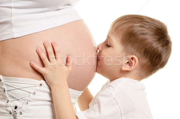 Young boy is kissing the pregnant woman Stock photo © ashumskiy