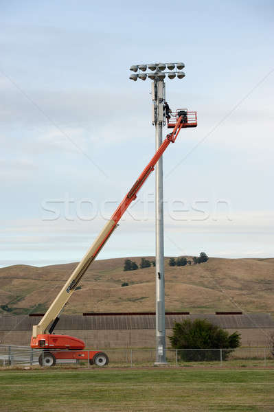 fixing a stadium light Stock photo © aspenrock