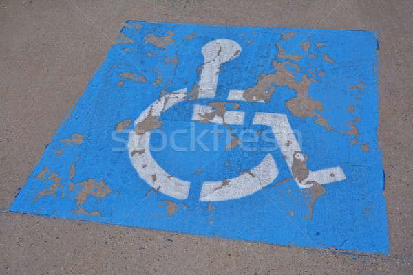 Disabled parking sign painted on asphalt. Stock photo © asturianu