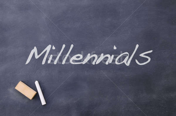 Blackboard with the word Millennials. Stock photo © asturianu