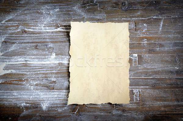 Parchment on wooden table covered with flour Stock photo © asturianu