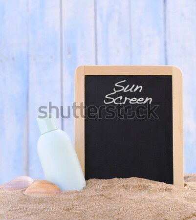 Foto stock: Aislado · protector · solar · pizarra · jar · arena · de · la · playa · playa