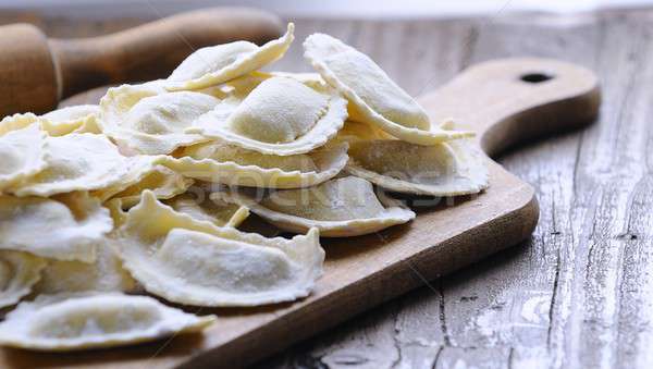 Homemade ravioli on wooden board Stock photo © asturianu