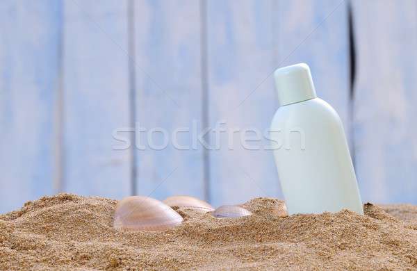 Protector solar jar arena de la playa playa sol salud Foto stock © asturianu