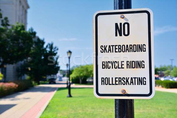 Sign prohibiting rollerskating and skateboards. Stock photo © asturianu