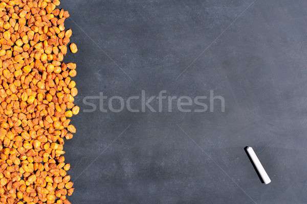 Stock photo: Toasted corn and blackboard.