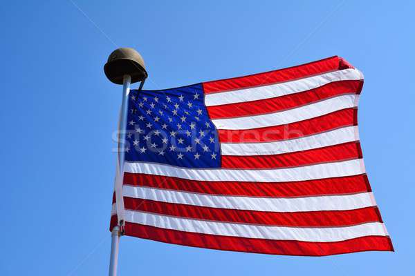 United States flag waving with a military helmet. Stock photo © asturianu