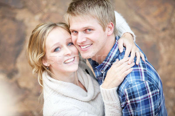 Young couple in love looking up at viewer Stock photo © avdveen