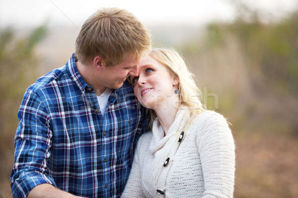 Young couple looking lovingly at each other Stock photo © avdveen