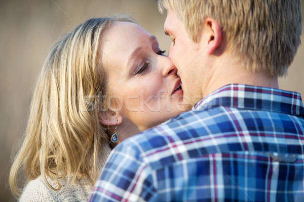Fiatal felnőtt pár csók kívül nappal fiatal Stock fotó © avdveen