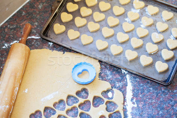 Stock photo: Wooden rolling pin, raw dough and heart shaped cookie cutter
