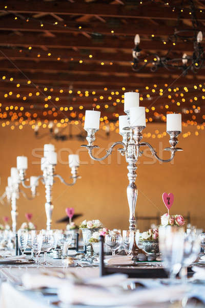 Candelabra With Candles On Decorated Wedding Reception Tables