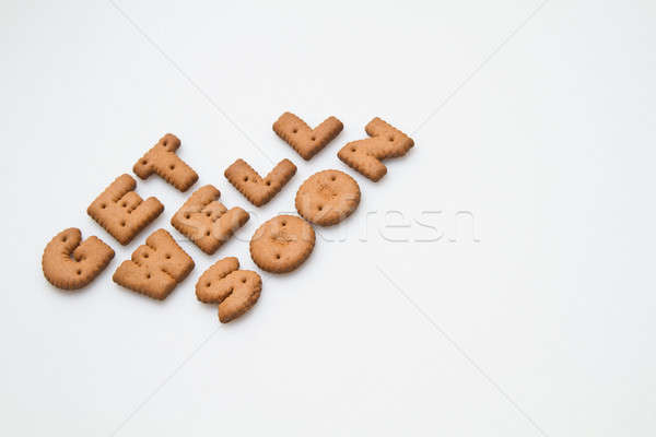 Bem logo marrom biscoitos branco superfície Foto stock © azamshah72