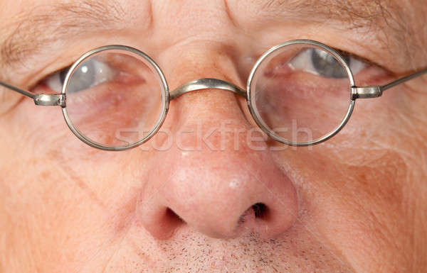 Senior man with focus on glasses Stock photo © backyardproductions