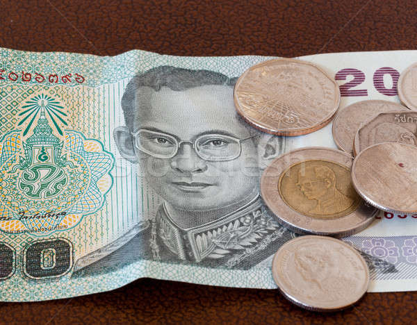 Twenty Baht note from Thailand with coins Stock photo © backyardproductions