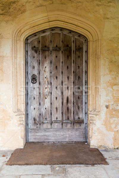 Ancient oak wooden door in stone surround Stock photo © backyardproductions